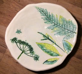 platter with impressed leaves and plants